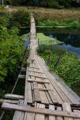 Obraz premium Vertical view of the footbridge over the river, skewed and lying on the water