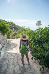 A young woman is walking and exploring the Greek island of Lefkada