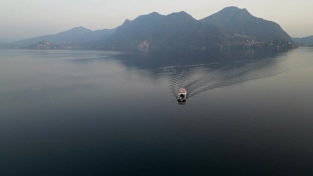 Stunning Aerial view of Ferry at Lake Maggiore taken on 2023 Verbania Province of Verbano-Cusio-Ossola, Italy.
