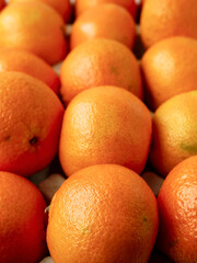 Close up of pile of juicy fresh mandarins or tangerine.