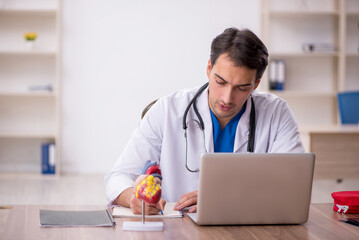Young male doctor in telemedicine concept