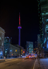 Fototapeta na wymiar Toronto CN Tower lit red and blue in night sky