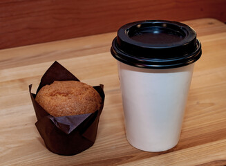 Coffee and muffin on the table