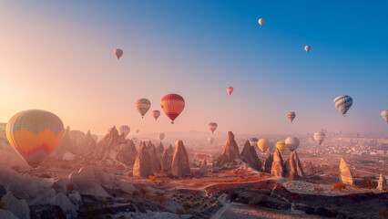 Landscape sunrise in Cappadocia with set colorful hot air balloon fly in sky with sunlight. Concept tourist travel Goreme Turkey - obrazy, fototapety, plakaty