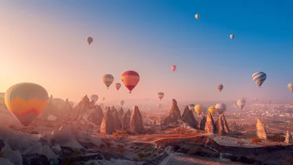 Deurstickers Landscape sunrise in Cappadocia with set colorful hot air balloon fly in sky with sunlight. Concept tourist travel Goreme Turkey © Parilov