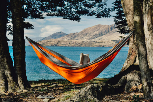 A person reading in hammock