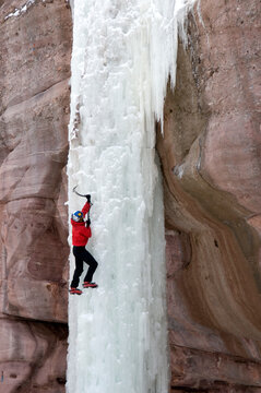 Man climbing ice pillar without a rope, Redstone, Colorado.