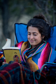 Portrait of woman sitting and reading book, New Mexico, USA
