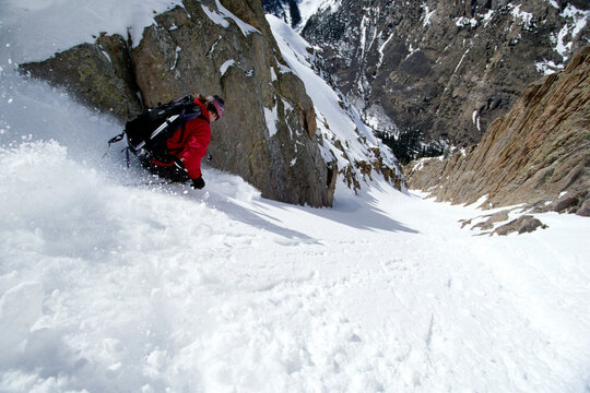 Skier charging down slope, Colorado