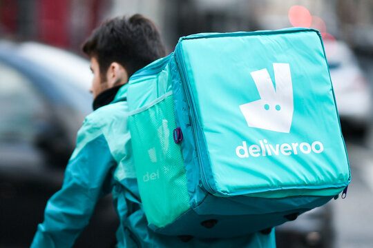 Illustration shows a deliver&nbsp;(man) for Deliveroo on his bike (bicycle). Delivers for home food (meal) delivery platforms, in Paris, France on December&nbsp;28, 2022.