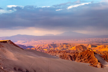 Fototapeta na wymiar Moon Valley dramatic landscape at Sunset, Atacama Desert, Chile