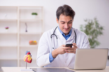 Young male doctor in telemedicine concept