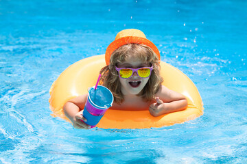 Happy child playing in swimming pool. Summer vacation concept. Summer kids portrait in sea water on beach.