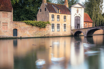 Fototapeta na wymiar Public park and canal near monastery with swans and ducks, Bruges, Belgium