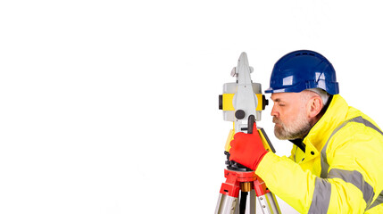 A builder engineer in a blue hat and yellow reflective coat on white background with space for text. Surveyor using modern surveying equipment isolate on white background