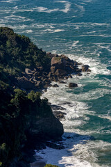 Waves crash on rocks on the north coast of S&atilde;o Paulo state, Brazil