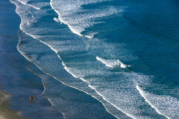 Waves break on the beach, on the north coast of the state of Sao Paulo, Brazil