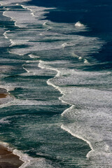 Waves break on the beach on the north coast of the state of Sao Paulo, Brazil