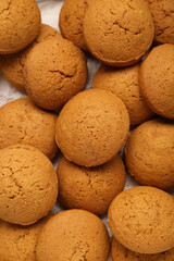 Many delicious oatmeal cookies as background, top view