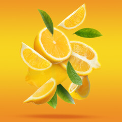 Fresh ripe lemons and green leaves falling on color background