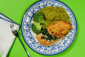 Balanced diet, keto diet. green pea puree, chicken breast with grilled vegetables, mushrooms and paprika. The concept of sports nutrition in disposable eco dishes, top view.