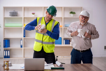 Two male architects working on the project