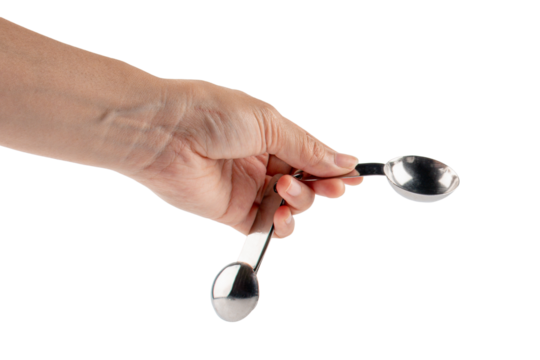 Hand and measuring spoon on transparent background