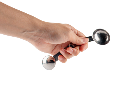 Hand and measuring spoon on transparent background