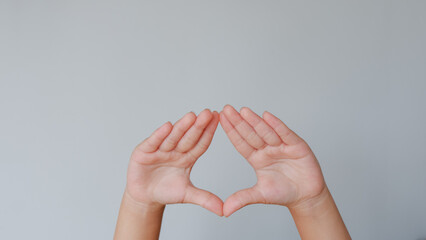 Fototapeta premium Child hand. The combined hands, are forming a triangle.