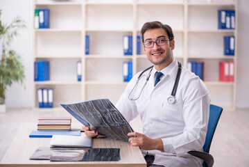 Young male doctor radiologist working in the clinic