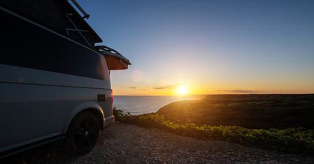 Transporter Camping Van bus at the California Ocean in the coastal Nature