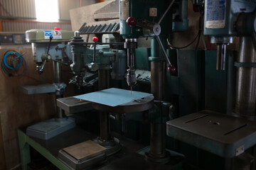 Part machining with drilling machine