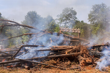 During construction of house uprooted forest was burned for construction of house to help build structure
