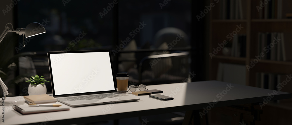 Canvas Prints modern workspace with laptop mockup on table in modern dark room in the background
