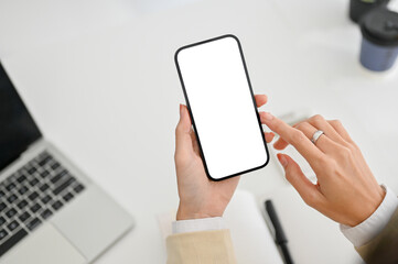 close-up image of a businesswoman using her smartphone at her desk. smartphone mockup.