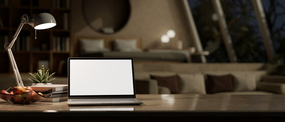 Notebook mockup with copy space on tabletop over blurred modern bedroom at night in background