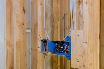 New residential construction framing unfinished wood frame house with basic electrical wiring