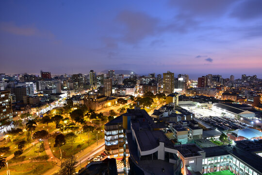 aerial view of the city with luxurious modern residential and office buildings square and cathedral-june 2021- metropolis miraflores peru in the background pacific ocean