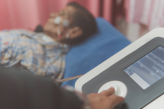 Facial palsy treatment concept, physiotherapy treatment equipment, electrotherapy equipment, Electrical Stimulation, physiotherapist holding electric stimulation to treat facial palsy