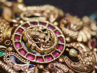 Bangalore, India 31st January 2023: Traditional Gold ornaments with marvelous stones and intricate designs. Temple gold jewellery.