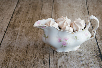 meringues on wooden background