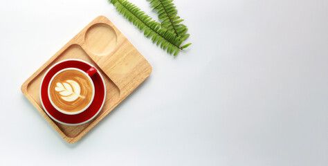 Coffee latte on a cup of white table. top view