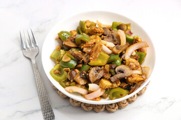 Fresh stir fried or sauteed vegetables. broccoli, zucchini, green and red peppers, mushrooms, onions, baby corn. colorful veggies in a white plate. Weightloss journey. Fitness concept. Healthy life.