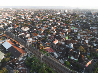 Fototapeta na wymiar Aerial traffic with in railway bridge in Yogyakarta City. Yogyakarta, Indonesia - January, 2023.