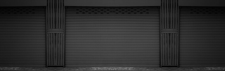 Dark gray rusty steel doors for steel metal sheet door background and texture.