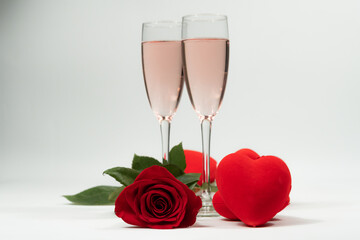 champagne glasses, a rose and hearts valentine's day