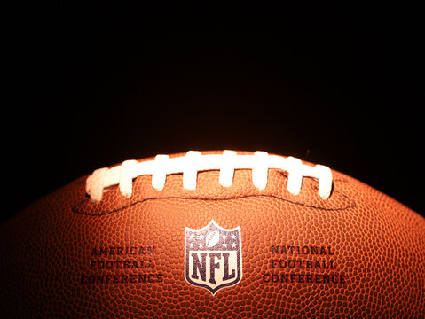 American football ball with emblem NFL. NATIONAL FOOTBALL LEAGUE. USA sports. Moscow, Russia - January 31, 2023.