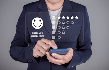 Business man choosing happy smiley face icon to give satisfaction in service. rating very impressed. Customer service and Satisfaction concept.