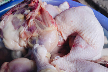 Raw chicken portions for cooking and barbecuing with skinless breasts and diced strips for goulash...