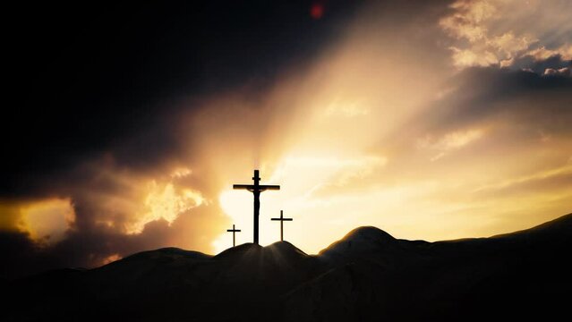 The brightly shining sky and the rays of light shining through the flowing clouds and the silhouette of the holy cross symbolizing the suffering, death and resurrection of Jesus Christ
